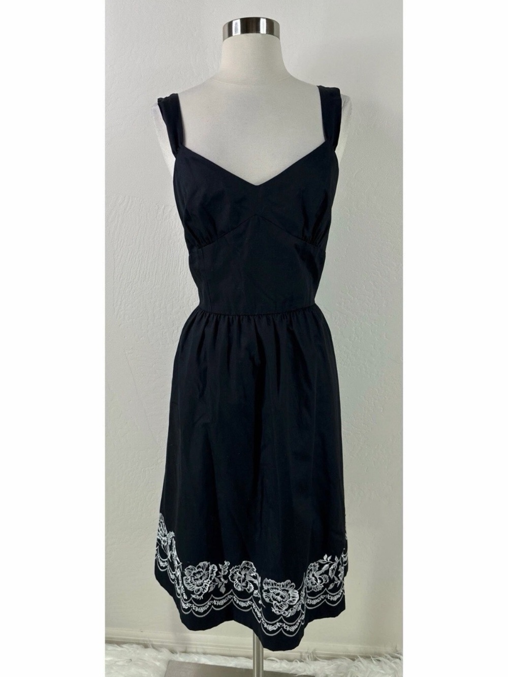 Black Sleeveless Dress with White Floral Hem